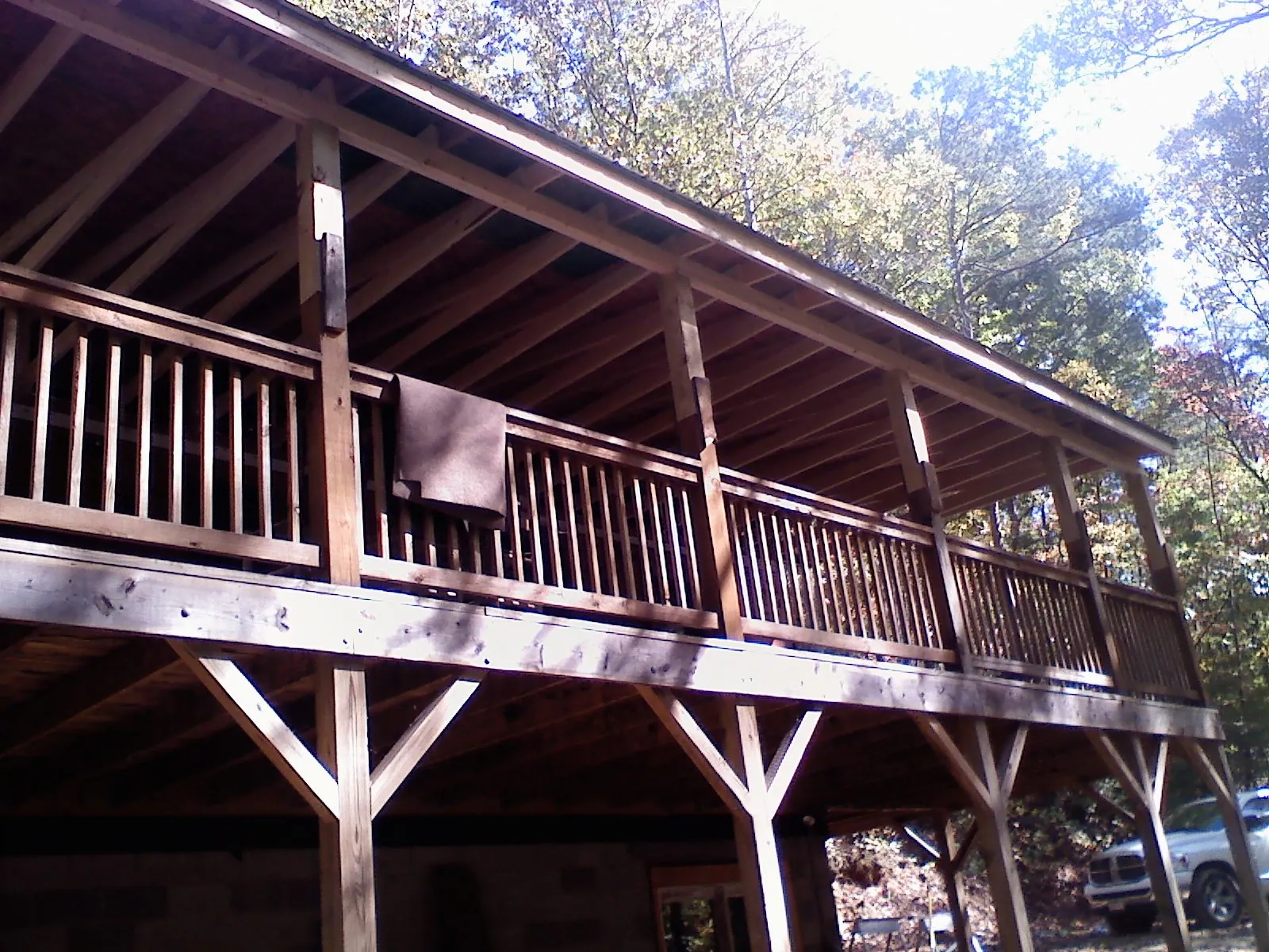Timber framing under a new elevated porch and deck — Roof Leak Repair in Hanna by Roofing Brothers